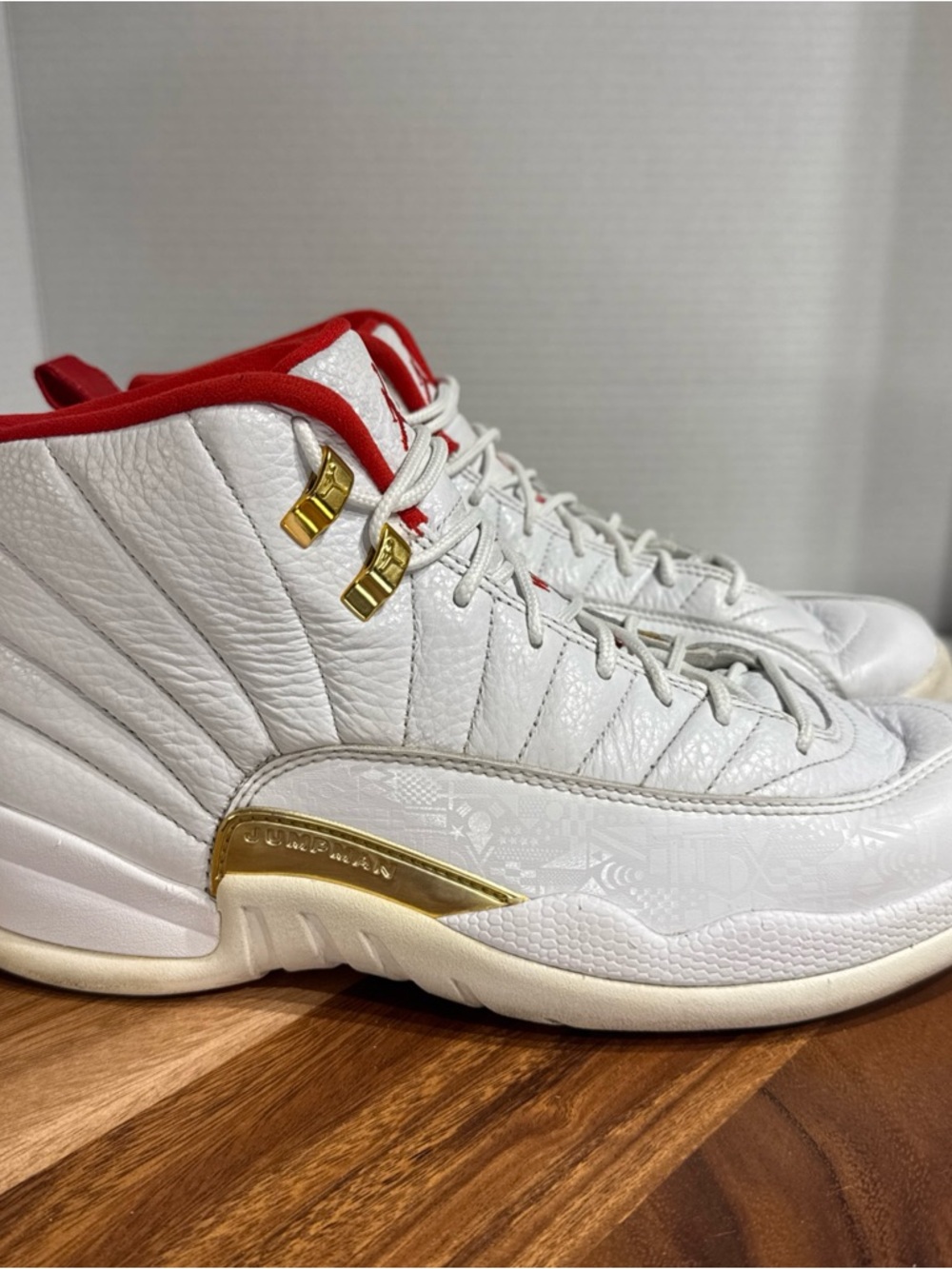 Jordan Men’s White and Red Athletic Shoes with Gold Accents